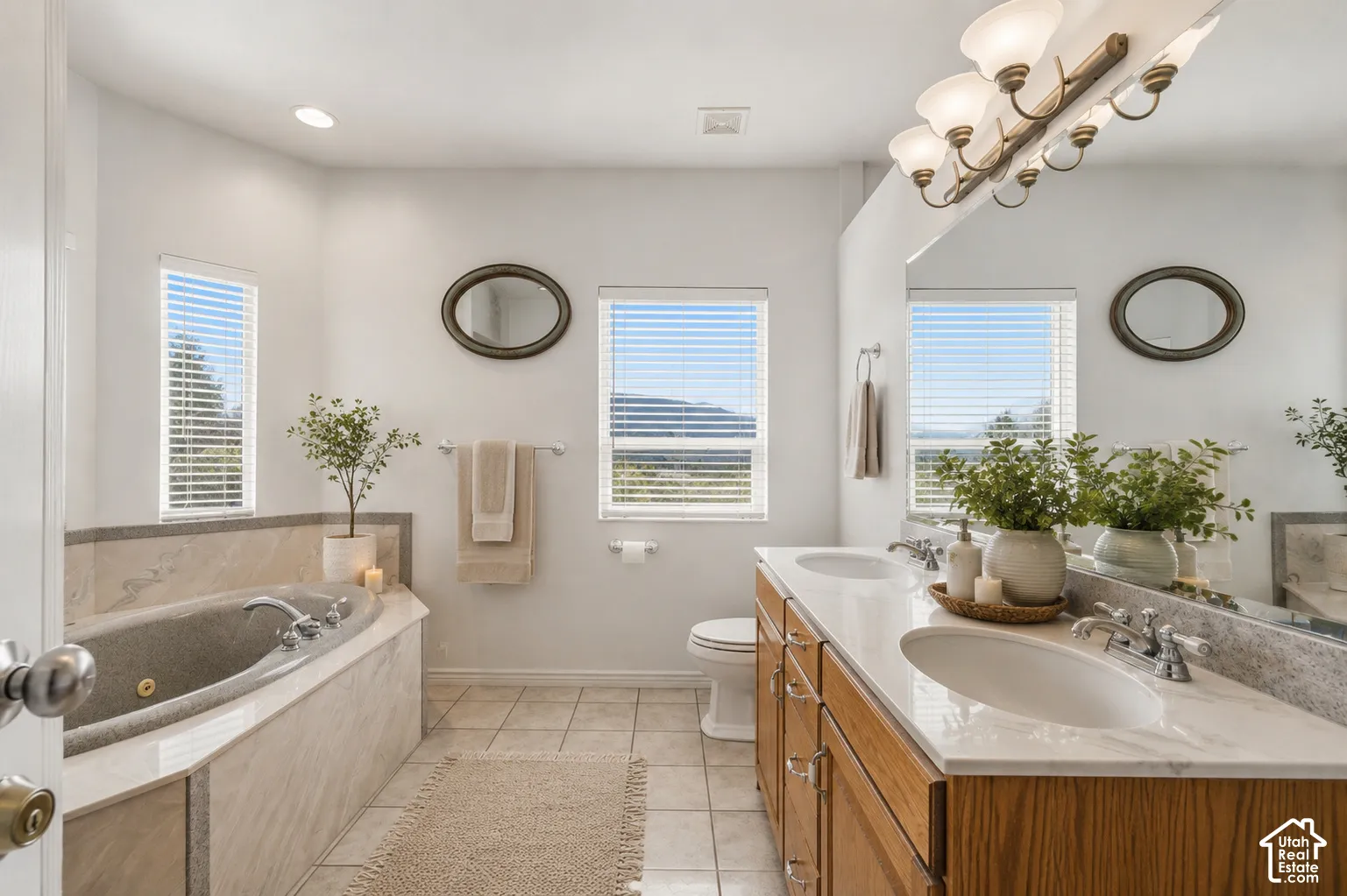Dual vanity with undermount sinks and wood-finish cabinetry