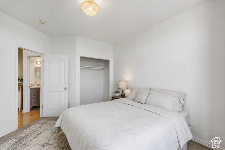 Recessed lighting, wood-finish flooring, and built-in closet with hanging rod