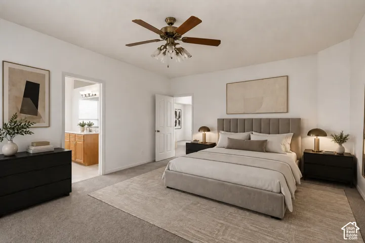 Spacious bedroom featuring neutral carpeting and a ceiling fan with integrated lighting