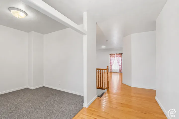 Recessed carpeted area with a flush-mount ceiling light