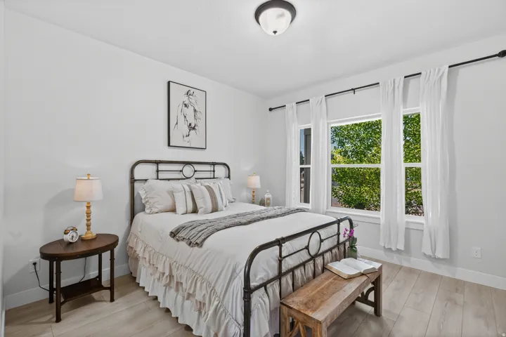 Bright room featuring light wood-finish flooring and white walls
