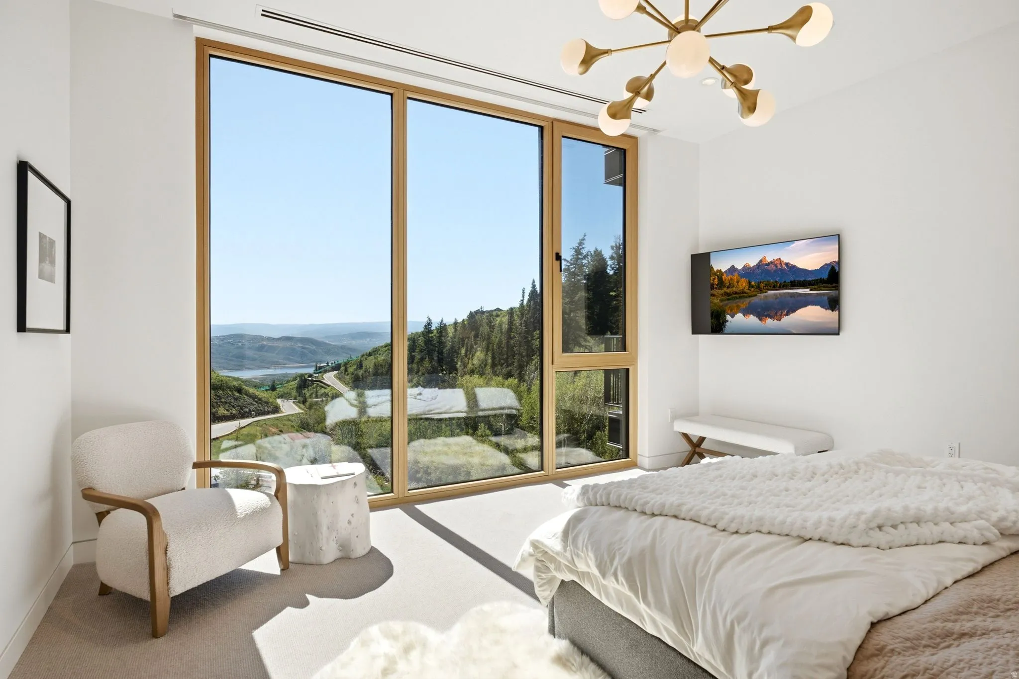 Expansive floor-to-ceiling window system with natural wood frames