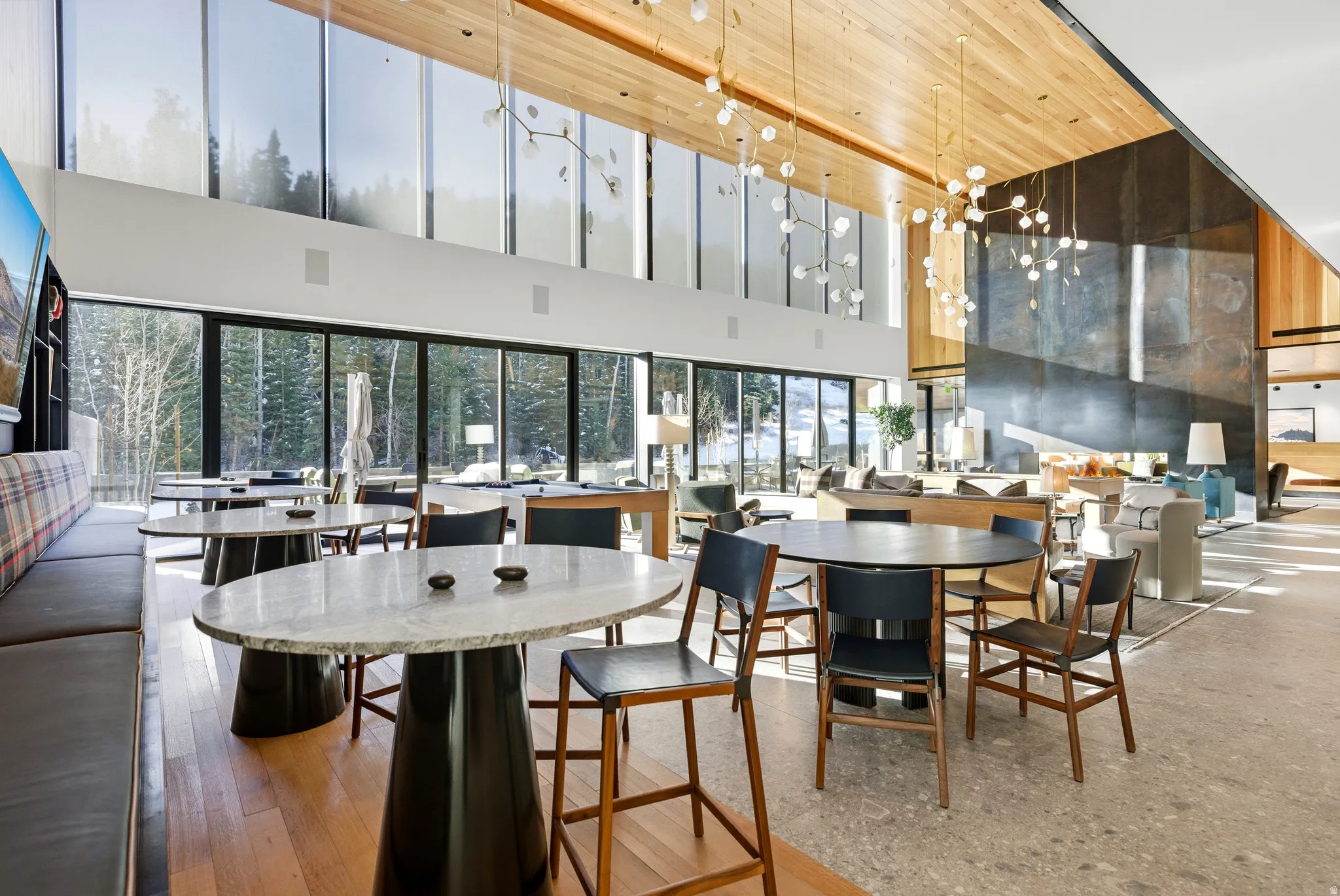Expansive room with high ceilings and floor-to-ceiling windows