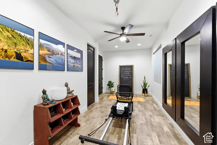 Versatile interior space featuring wood-finish flooring and recessed lighting