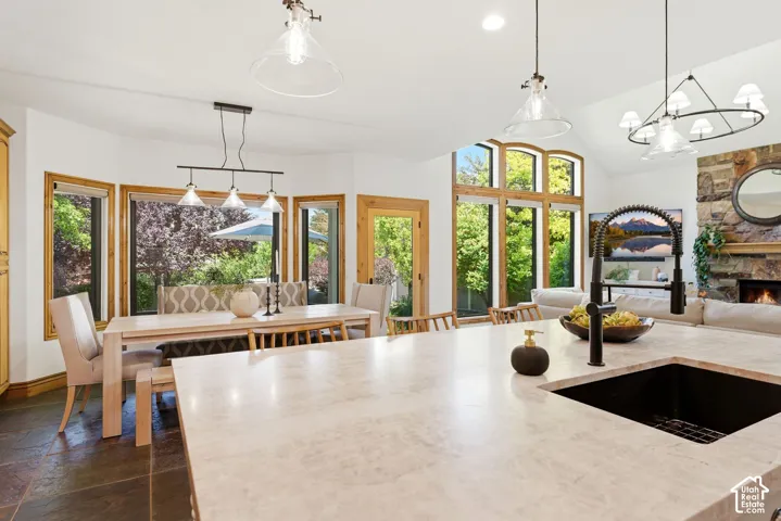 Large kitchen island with an integrated black sink and matte black faucet