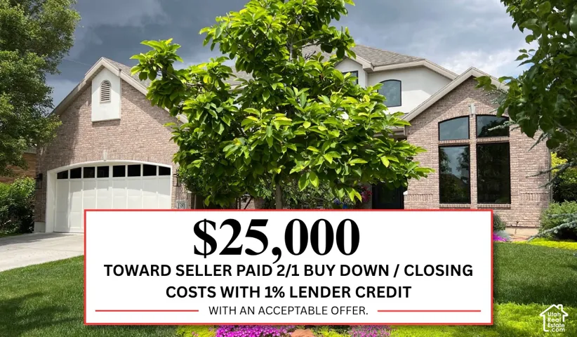 Brick exterior, arched window details, attached garage, well-maintained landscaping, and mature trees
