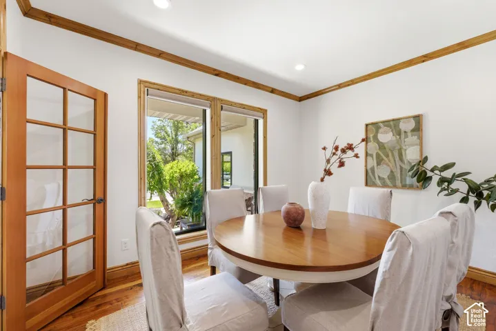 Wood-finish flooring with coordinating wood trim and crown molding