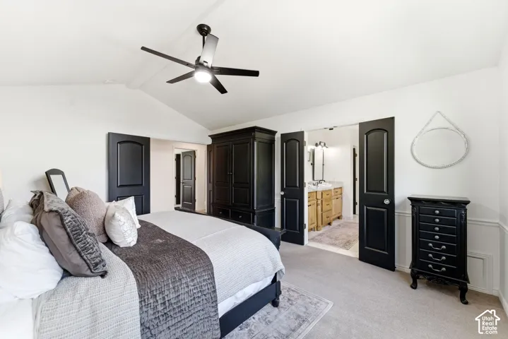 Vaulted ceiling featuring a contemporary ceiling fan
