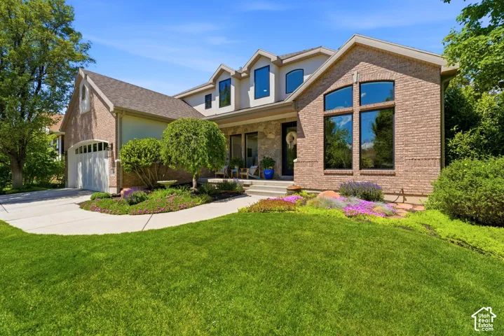 Brick exterior with stone accents and a gabled roofline