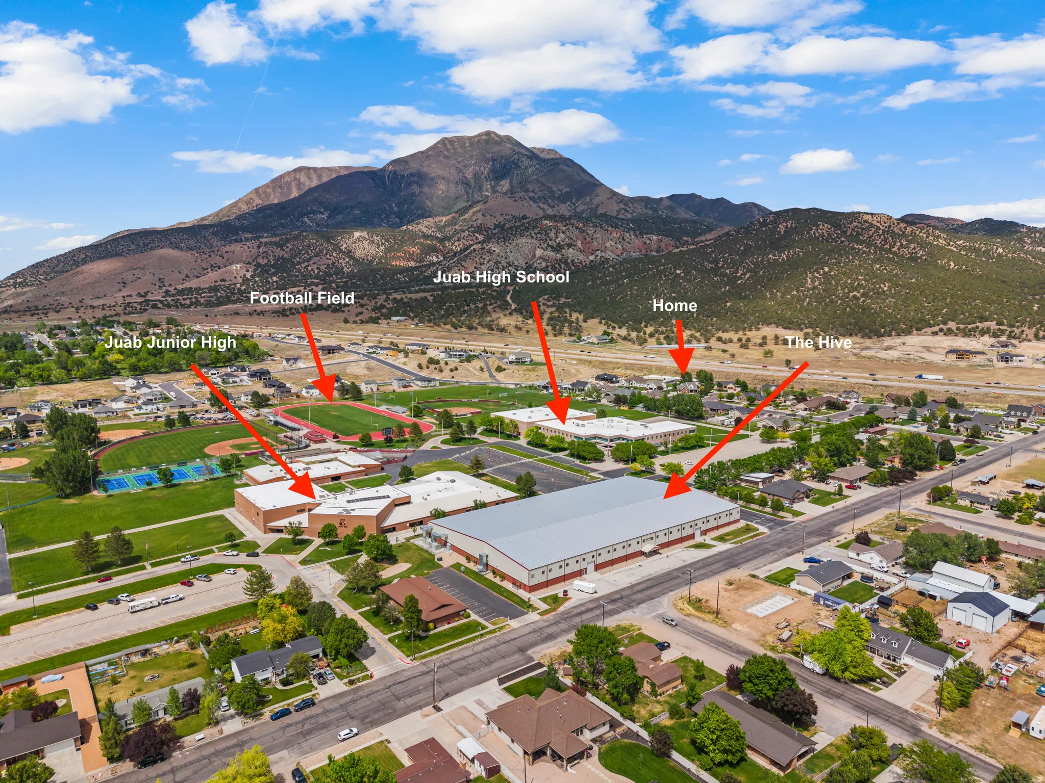 Aerial perspective showcasing the property's setting with mountainous backdrop