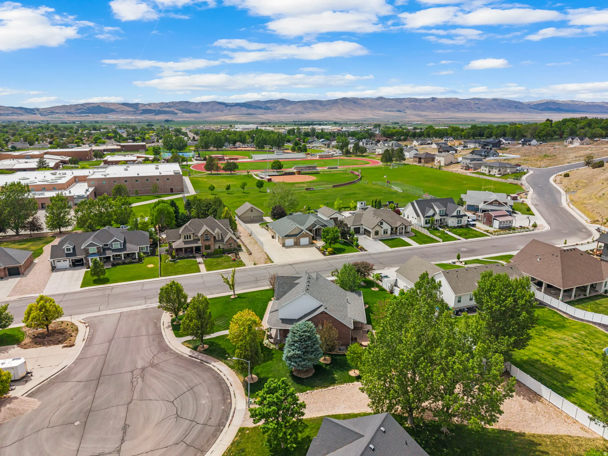 Residential neighborhood featuring varied architectural styles and mature landscaping
