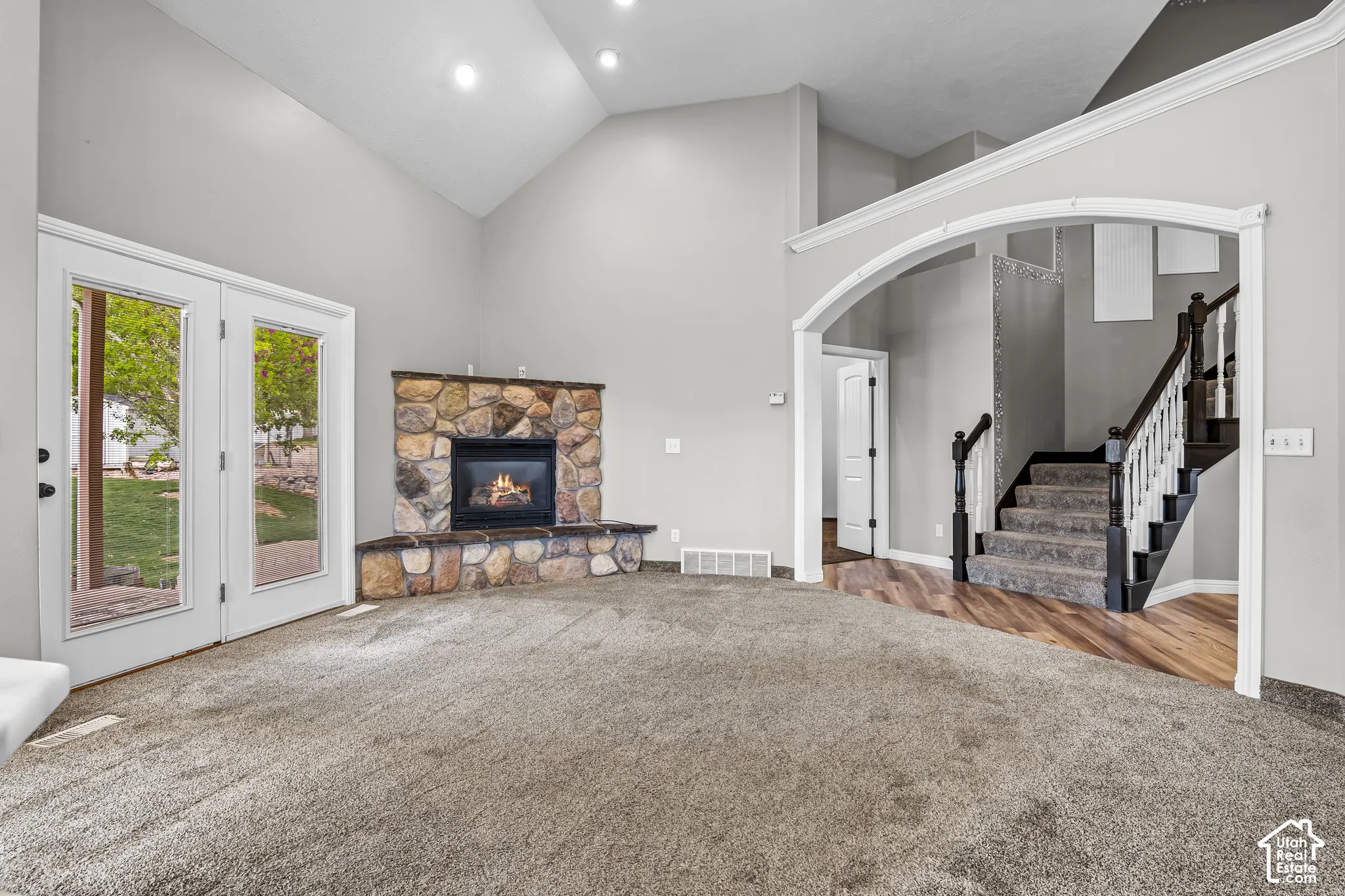 Great room with vaulted ceilings and recessed lighting