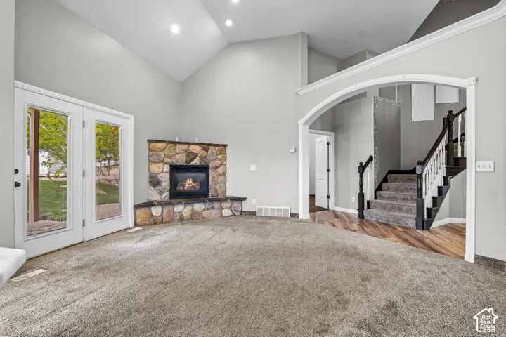 Great room with vaulted ceilings and recessed lighting