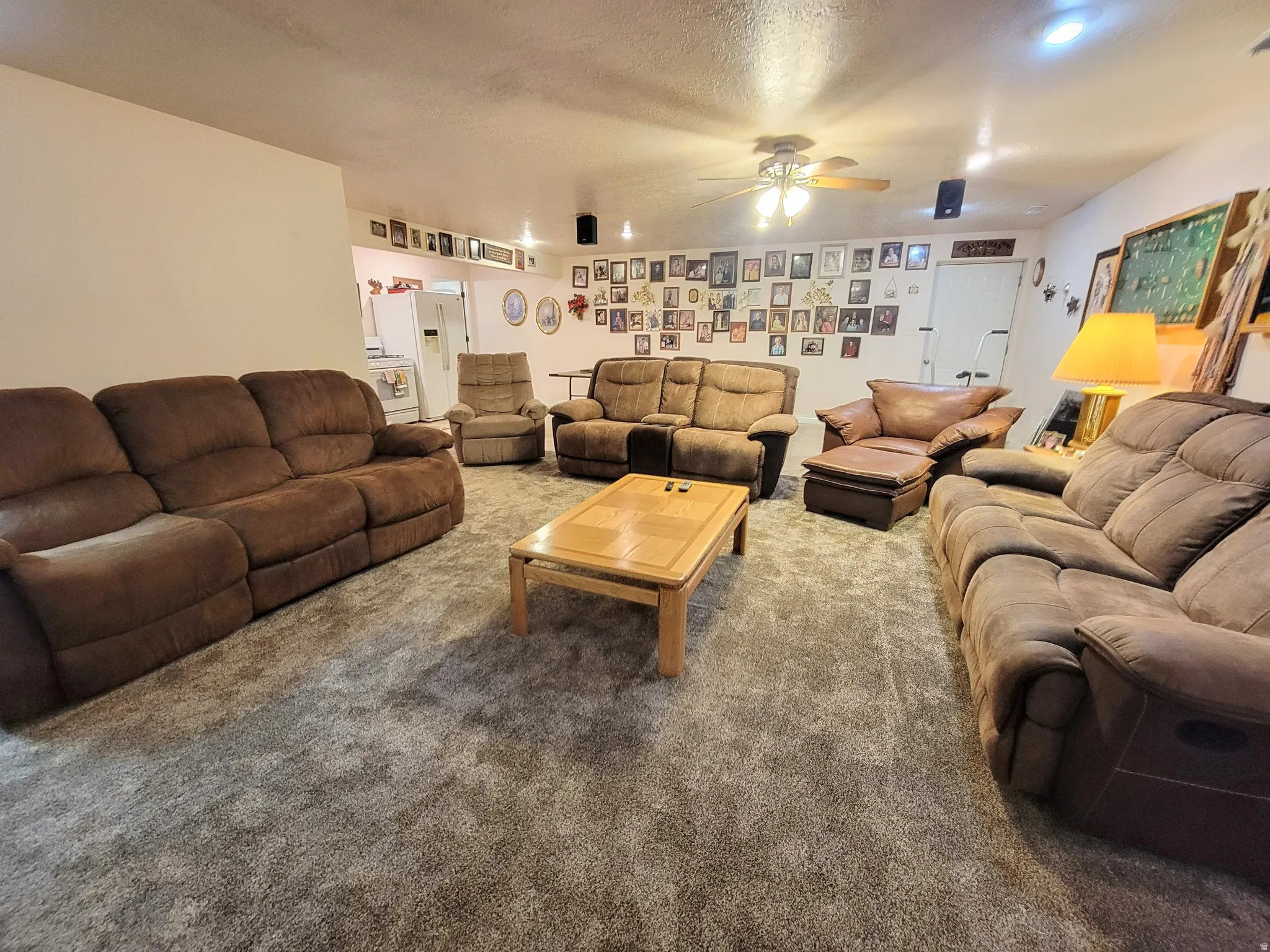 Spacious room featuring neutral carpeting and white walls