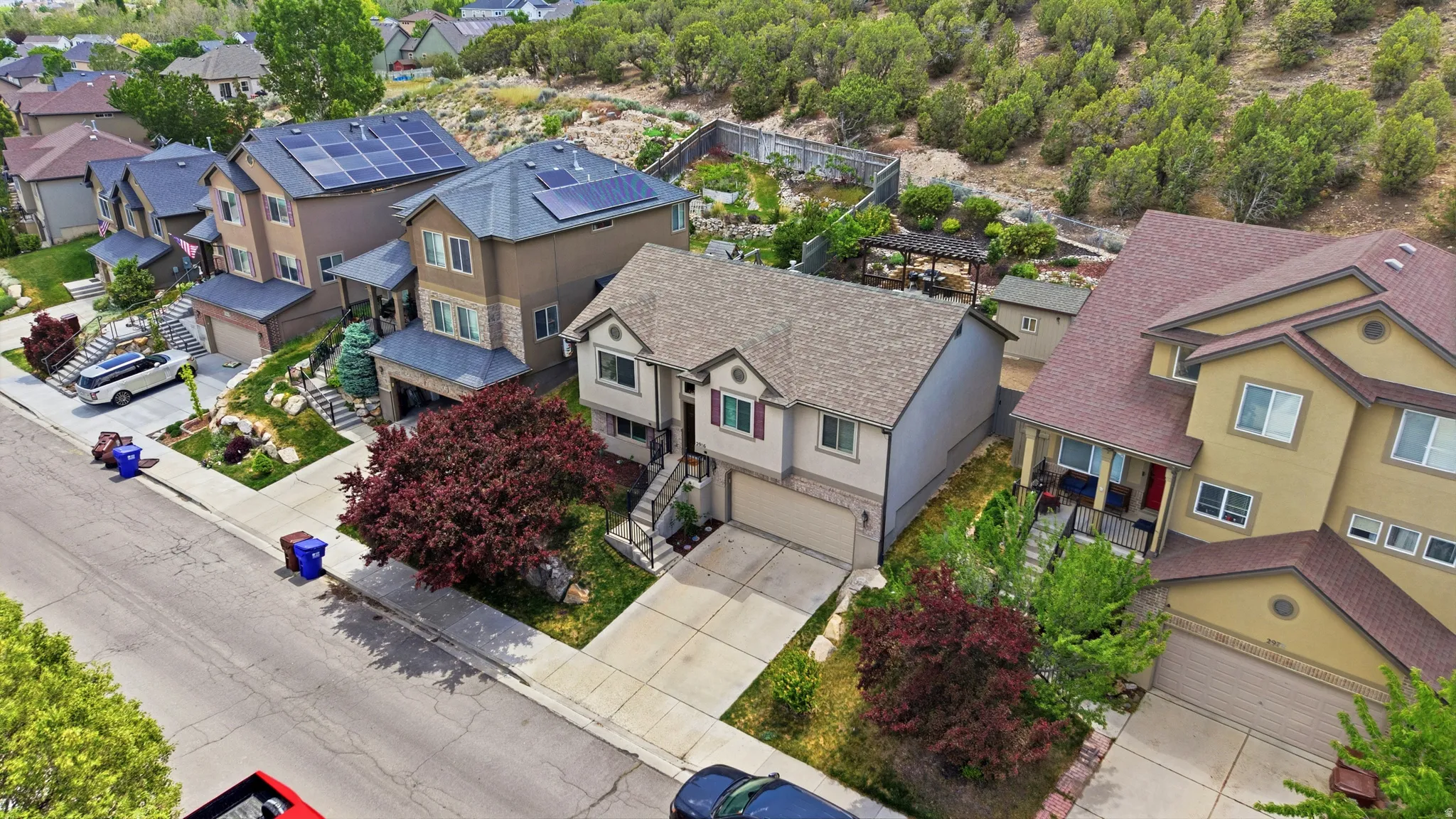 Two-story property featuring a front-facing garage and no neighbors behind you