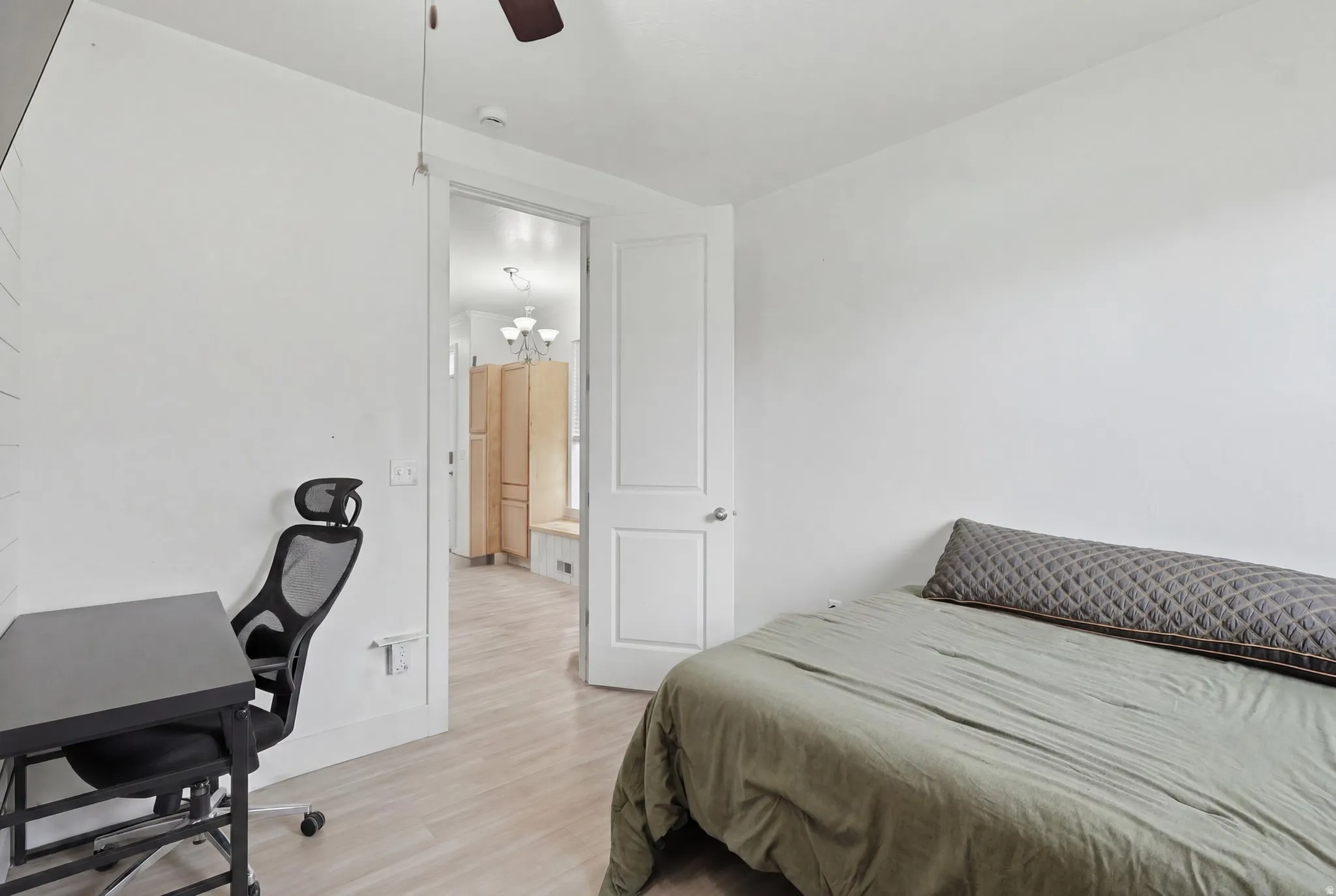 Light wood-finish flooring complements white walls