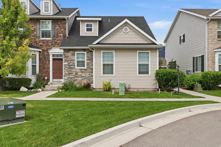 Craftsman-style residence featuring a combination of stone veneer and horizontal siding