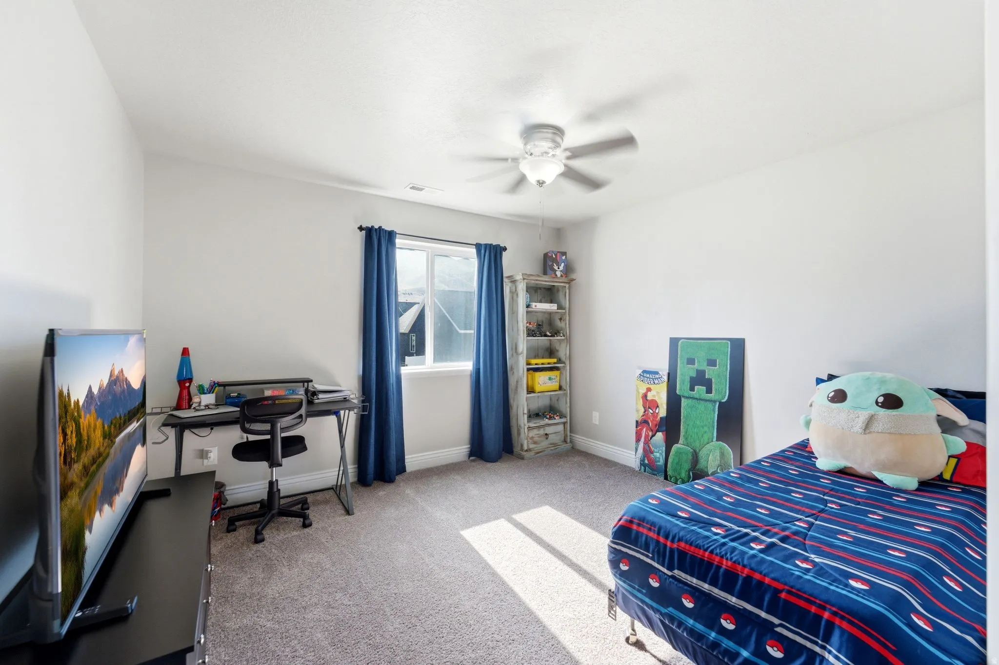 Light gray walls with textured gray carpeting