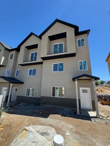 Contemporary multi-level exterior with a neutral stucco finish