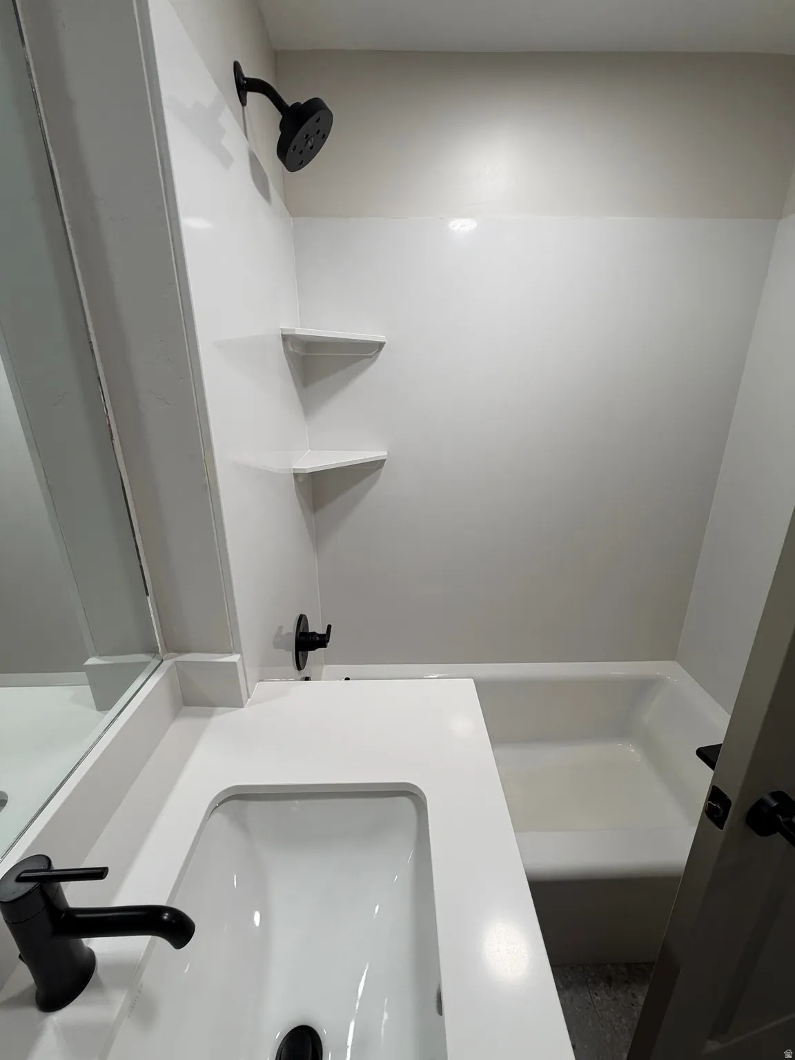 Bathroom featuring a modern vanity with a rectangular undermount sink and a white countertop
