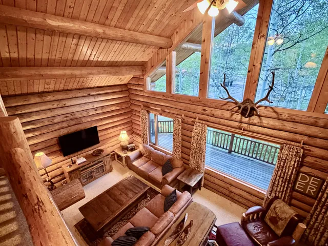 Vaulted wood-paneled ceiling with exposed beams