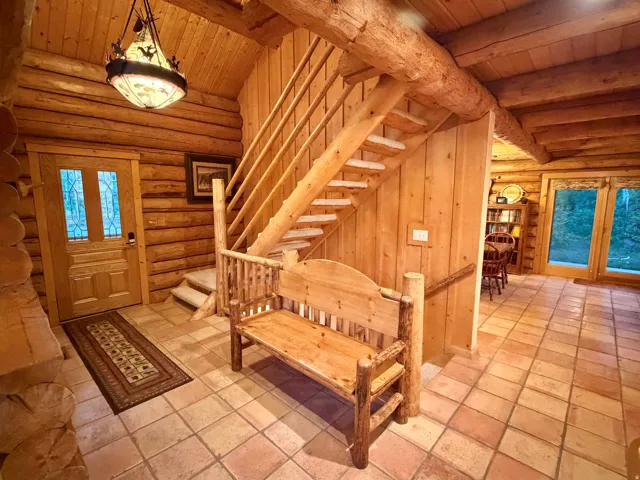 Rustic wood log construction throughout