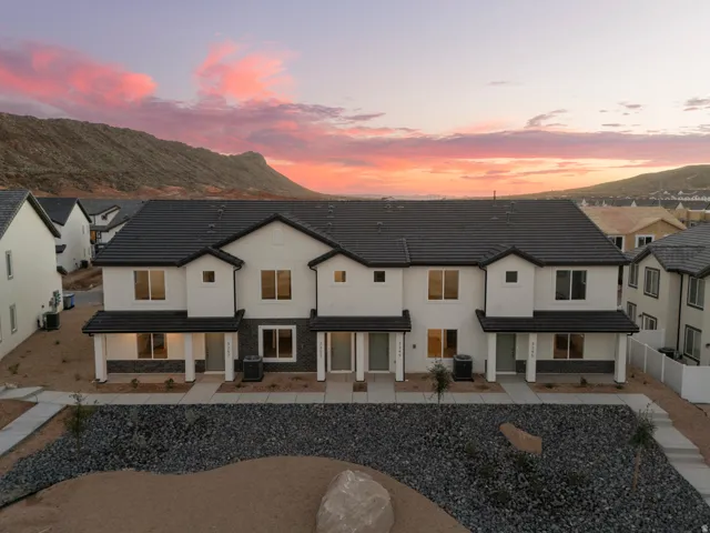 *All photos are of a similar model.  Colors and finishes may vary*Modern stucco exteriors featuring dark tile roofs and stone accents