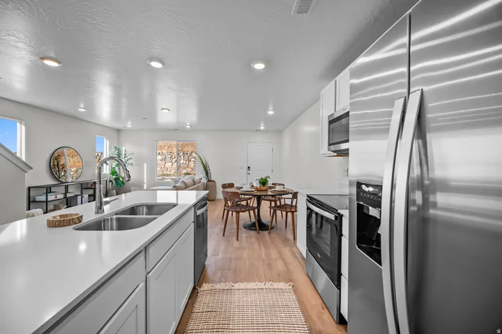 Kitchen island with dual stainless steel sinks and a contemporary chrome faucet