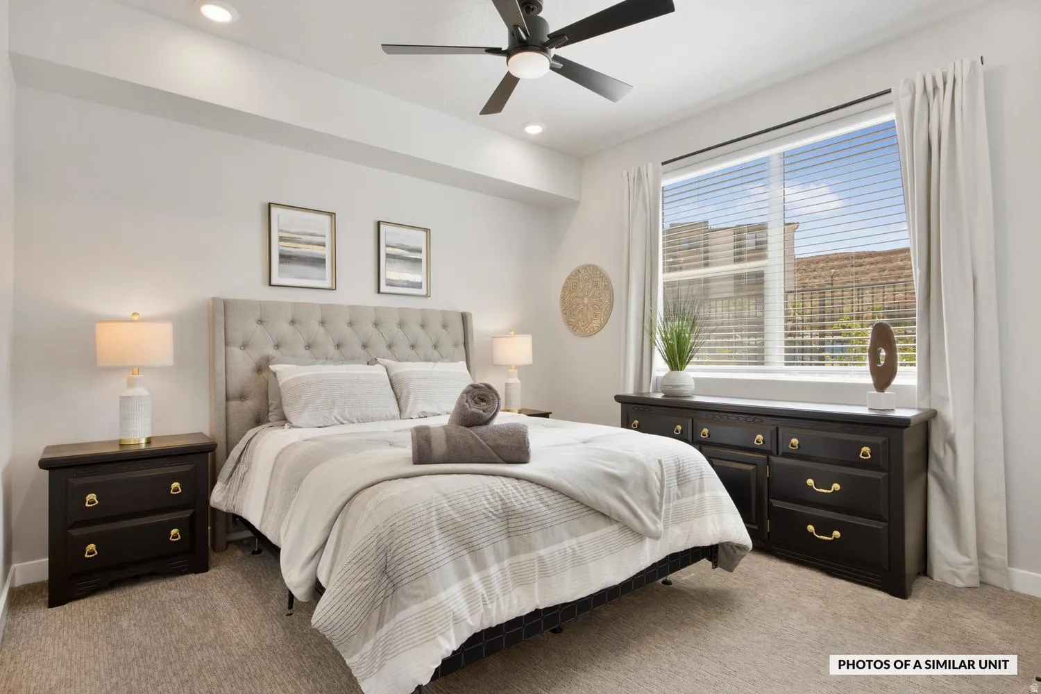 Bedroom featuring a ceiling fan with integrated lighting, recessed lighting, and a large window with blinds and drapery