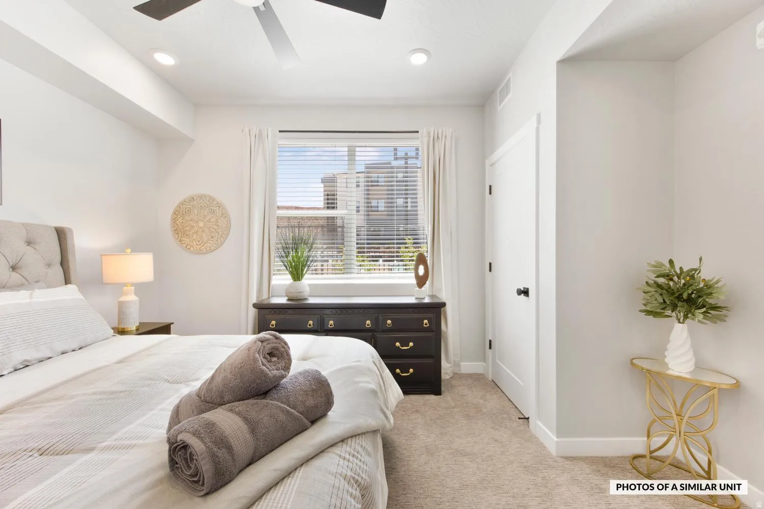 Carpeted bedroom featuring a window with blinds, recessed lighting, and a ceiling fan