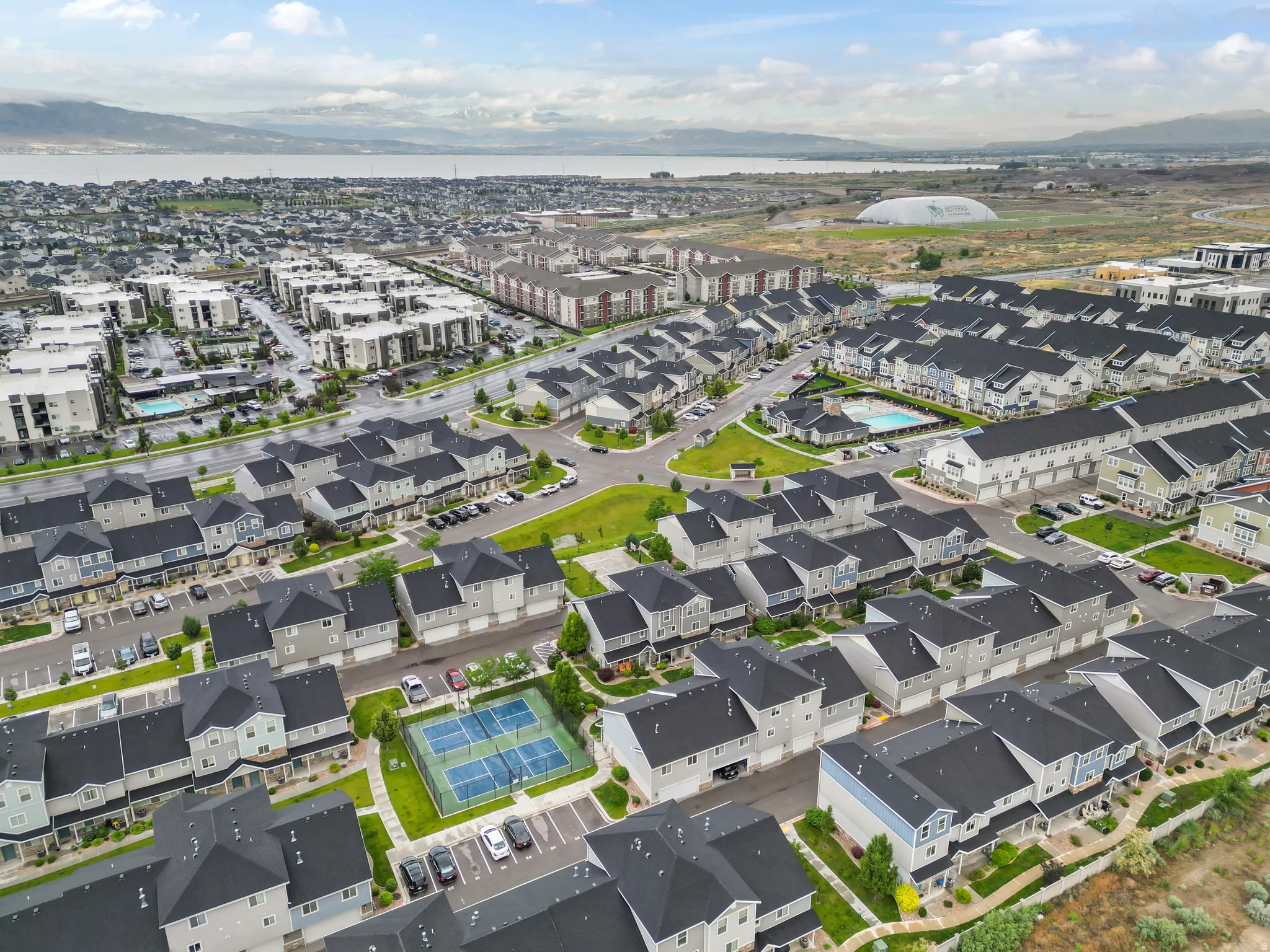 Contemporary residential development featuring a collection of townhomes and multi-story buildings