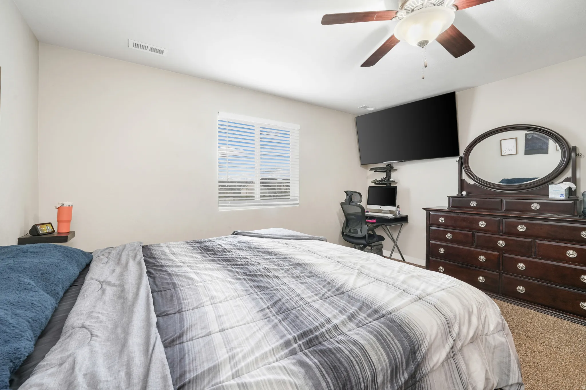 Interior room featuring light-colored walls and carpet flooring