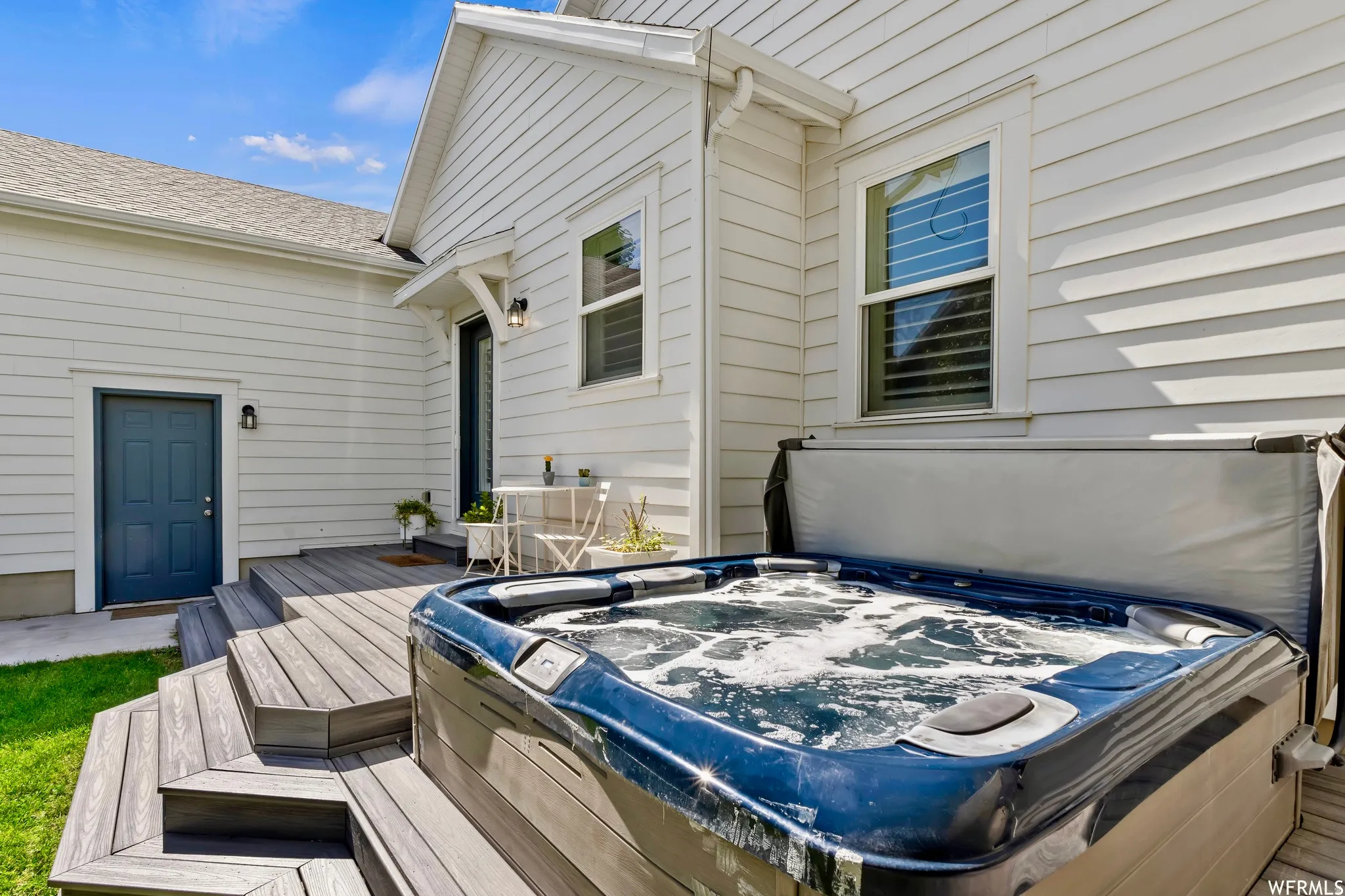 Integrated hot tub on a multi-level composite deck
