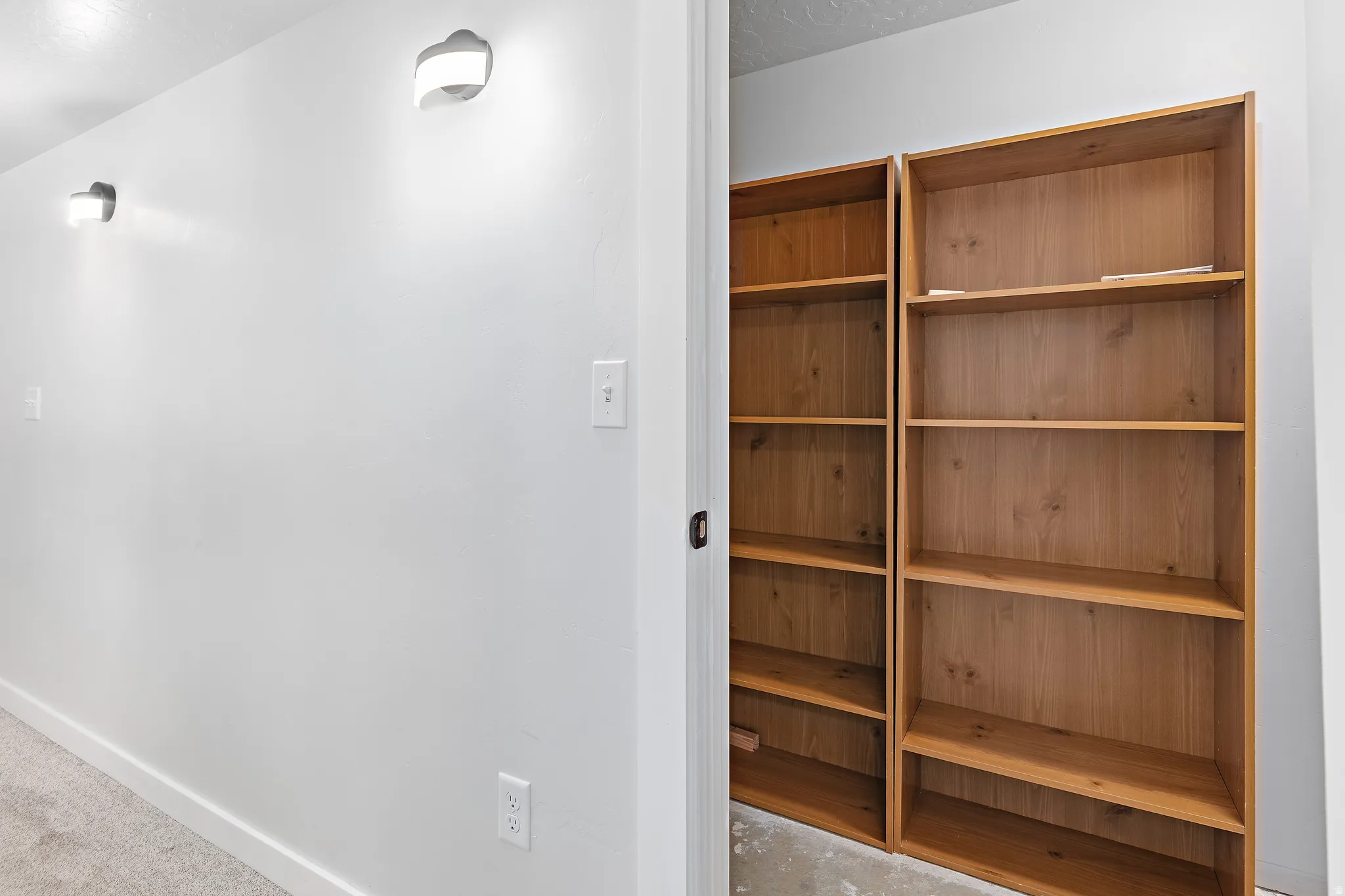 Built-in wood-finish shelving providing organizational solutions