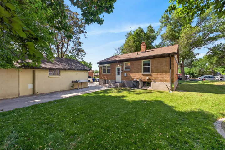 Nice shady back yard with patio.