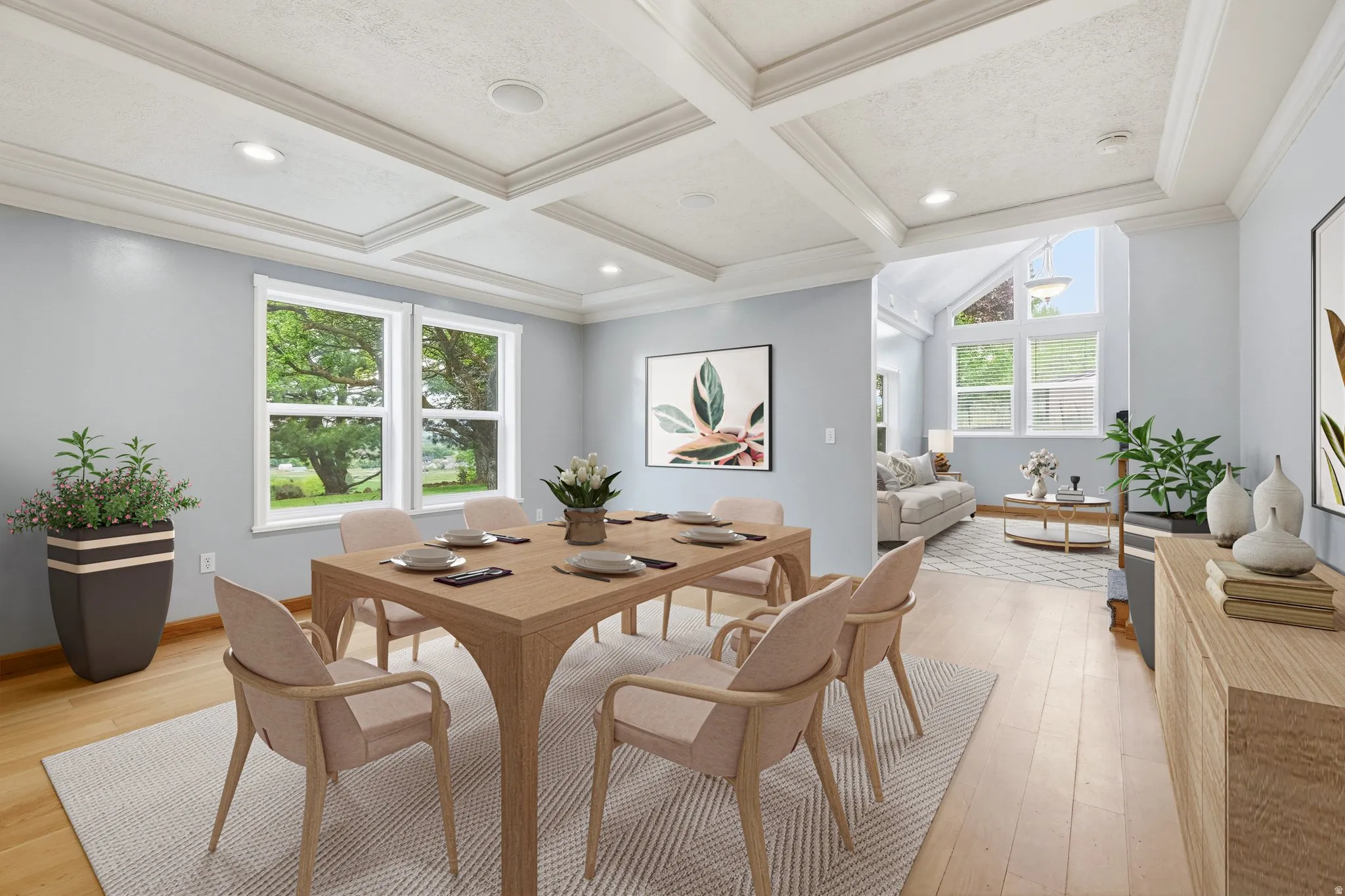 Dining area featuring wood-finish flooring, a coffered ceiling with recessed lighting, and light blue walls