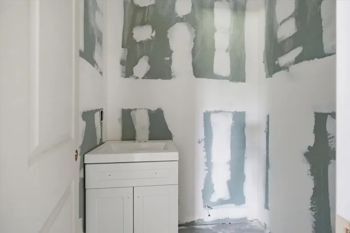 White shaker-style vanity with integrated sink