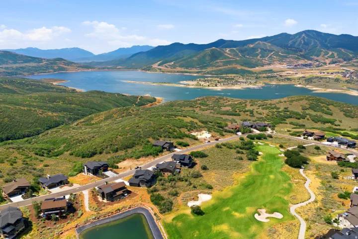 Expansive lake and mountain scenery with golf course frontage