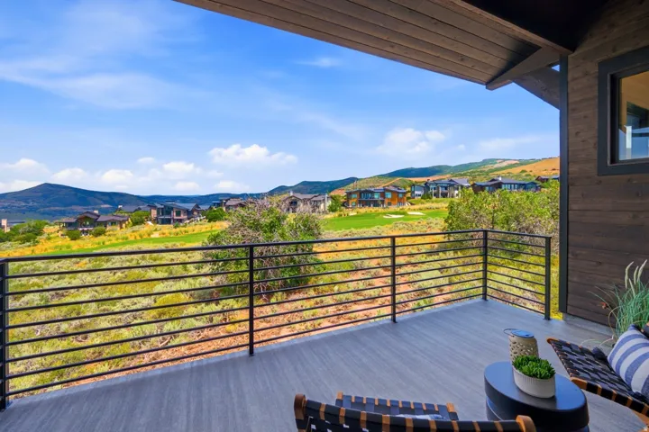 Spacious outdoor deck with composite decking and horizontal metal railings