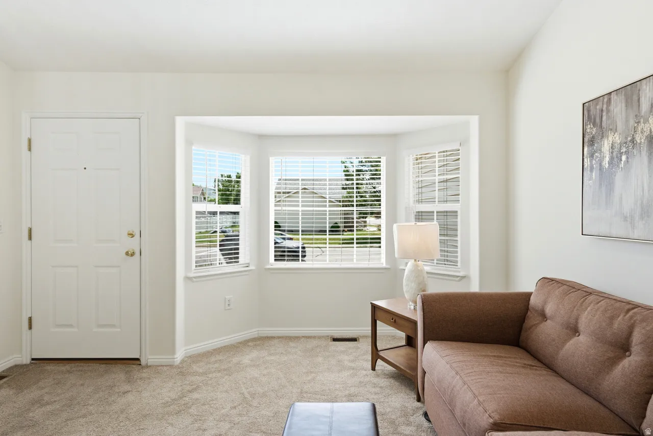 Bay window featuring multiple panels and blinds
