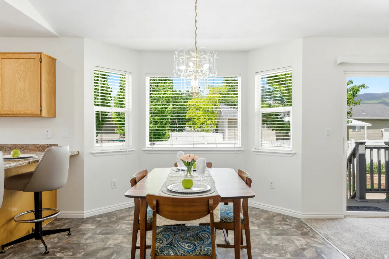 Bay window dining area with wood-finish flooring
