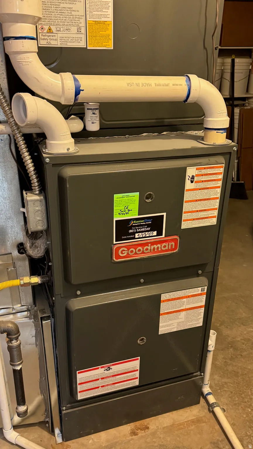 New Goodman high efficiency furnace with white PVC venting and gas line connection
