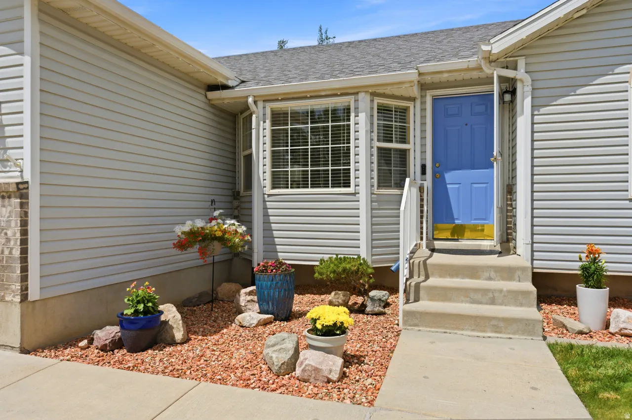 Siding exterior with a prominent blue entry door