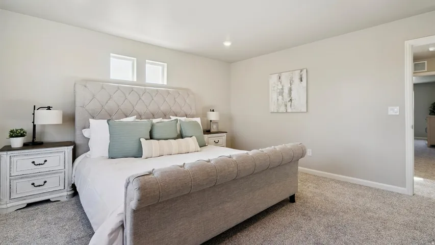 Carpeted bedroom featuring neutral wall paint, recessed lighting, and high-set windows