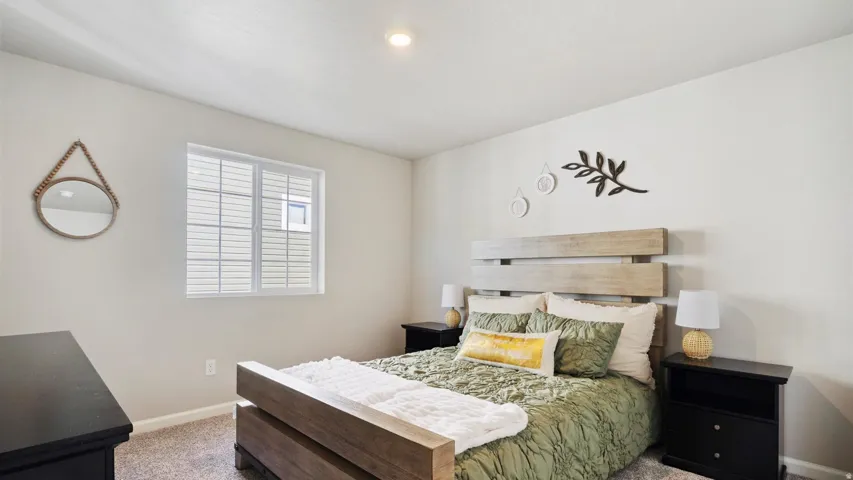 Carpeted room featuring a double-paned window, neutral wall paint, and a built-in overhead light fixture