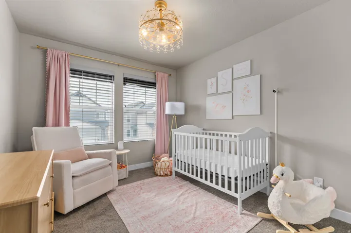 3rd Bedroom featuring two windows with blinds and neutral wall paint