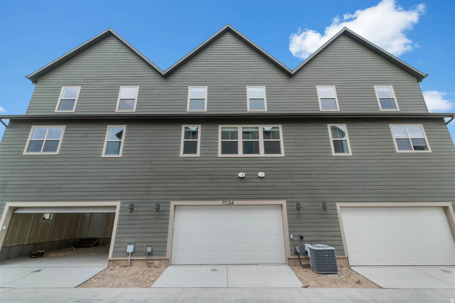 Contemporary multi-story exterior with horizontal siding and multiple windows