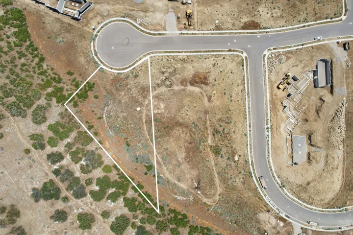 Expansive parcel with clear boundary lines, featuring direct road frontage and a cul-de-sac location