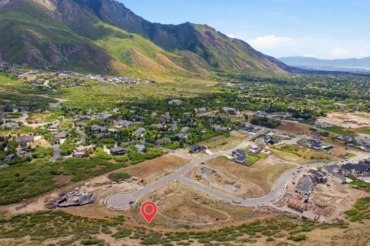 Aerial panorama showcasing a developing residential area with paved streets and cul-de-sacs