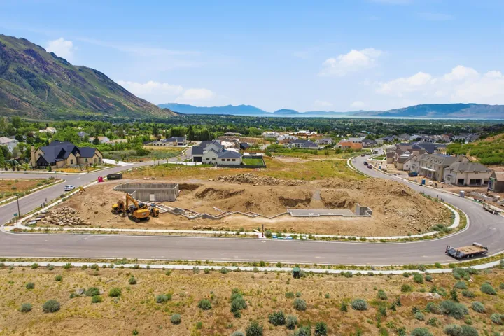Building lot featuring a newly poured concrete foundation